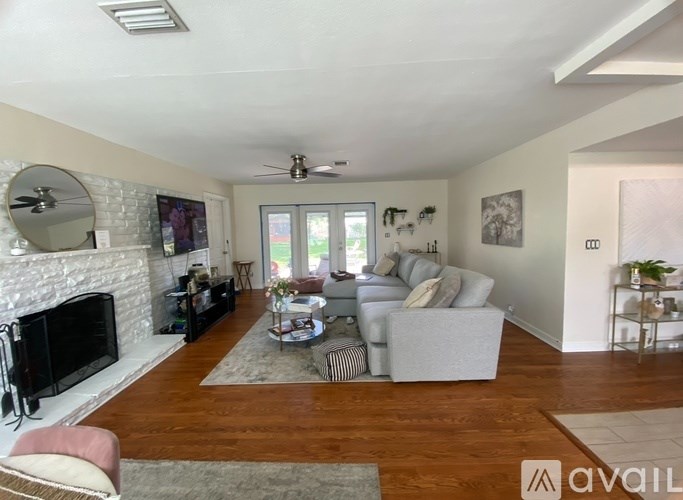 A living room with a fireplace and a couch.