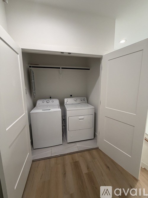 A small laundry room with two washing machines.