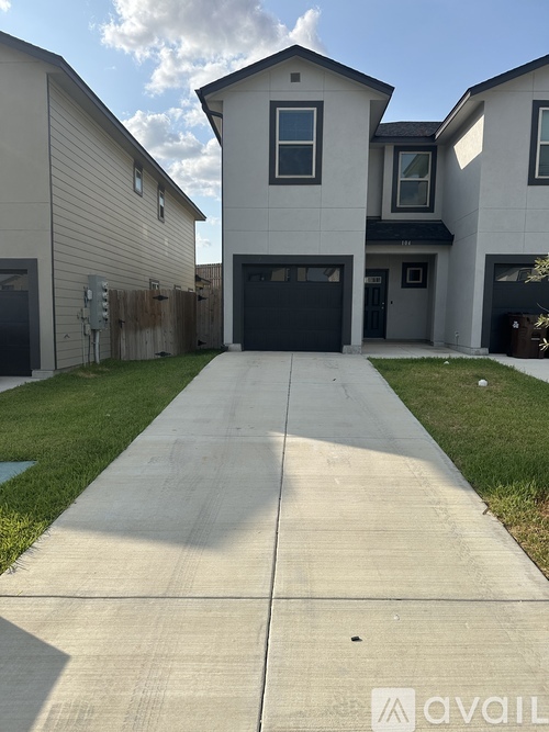 A house with a driveway in front of it.