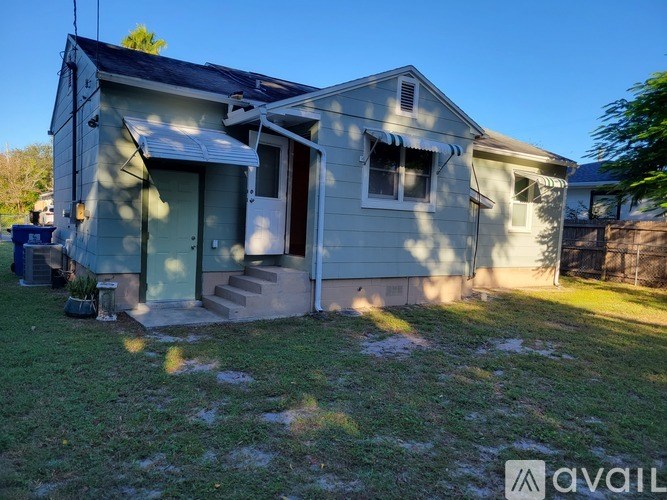 A house with a blue sky in the background.