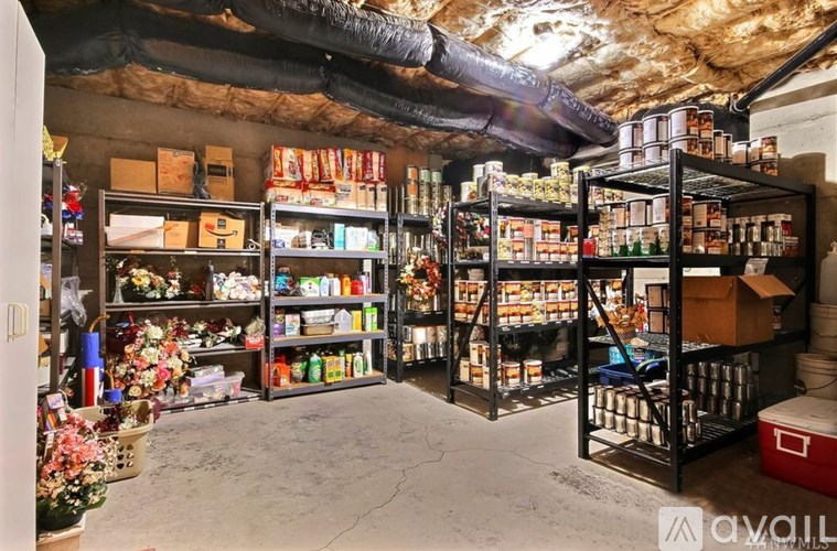 A storage room with shelves filled with various items.