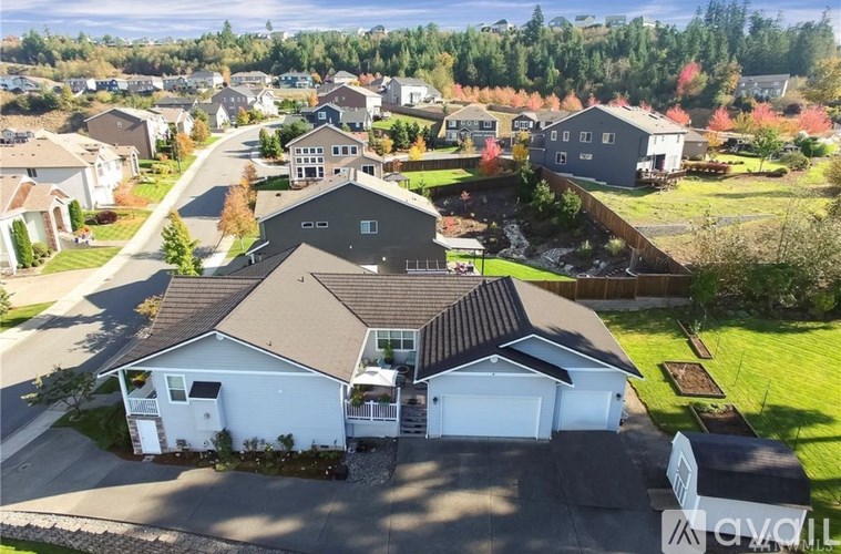 A bird's eye view of a residential area with houses and trees.