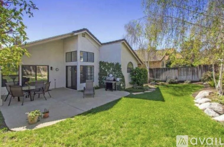 A house with a patio and a garden.