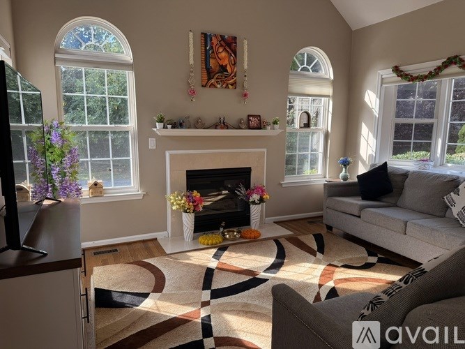 A living room with a fireplace and a couch.