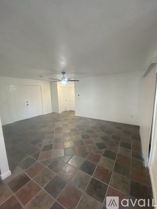 A room with a tiled floor and a light on.