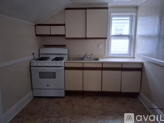 A room with a window and a door.