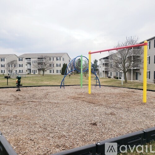 A playground with a red horizontal bar, a blue vertical bar, and a green vertical bar.