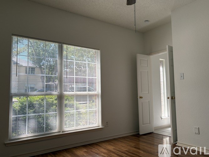 A room with a window and a door.