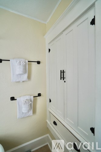 Two towels are hanging on a towel rack.