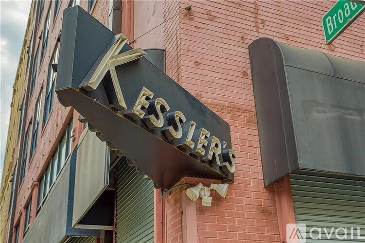 A neon sign for Kessler's hangs over a building.