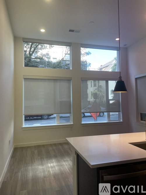 A kitchen area with a counter and a window.