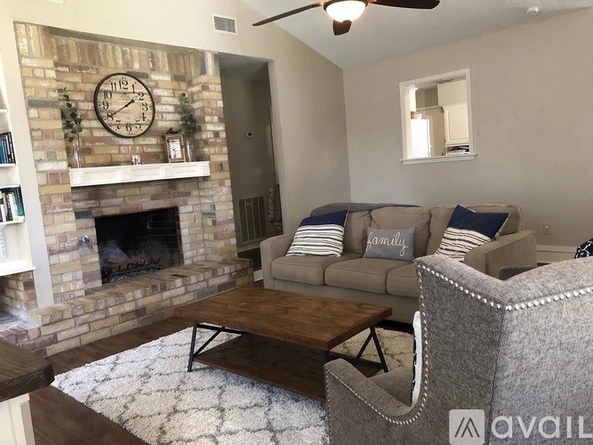 A living room with a fireplace and a couch.