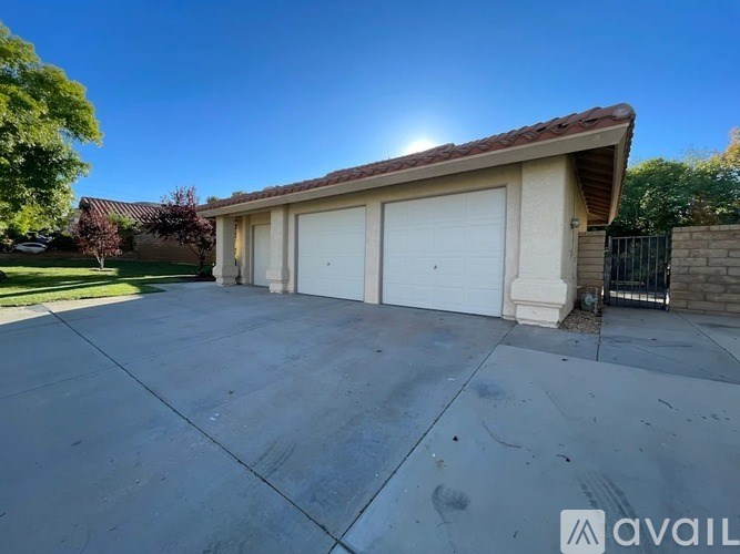 A house with a garage and a driveway.