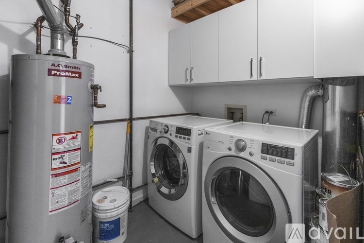 A washing machine and dryer in a small laundry room.