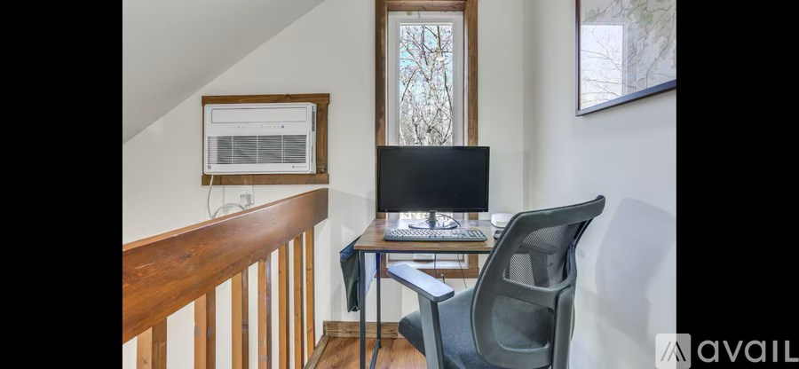 A room with a desk and a chair.