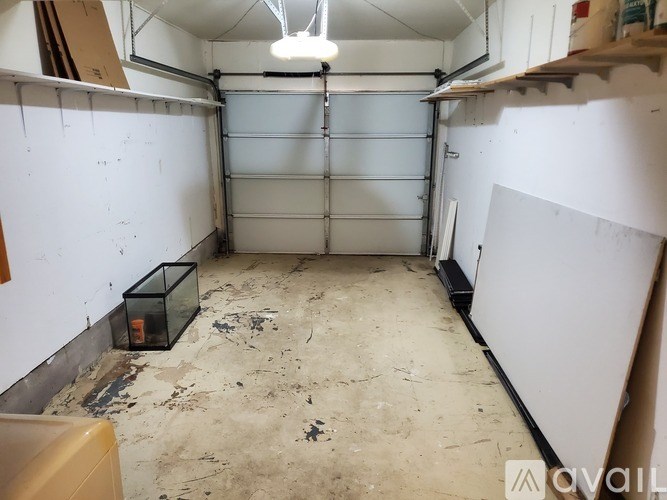 A room with a white wall and a white door is available for rent.