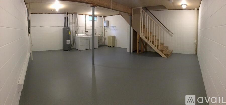 A spacious basement with a staircase leading to the upper floor.