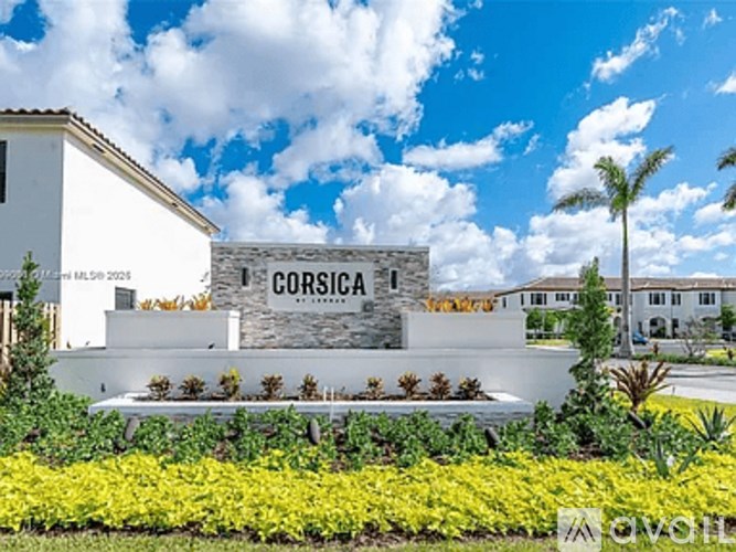 A white building with the word CORSICA on it.