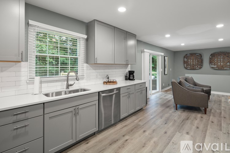 A modern kitchen with a sink and a window.