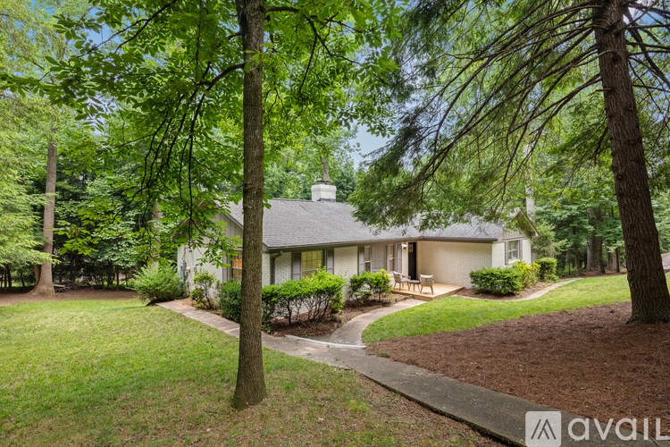 A house with a tree in front of it.