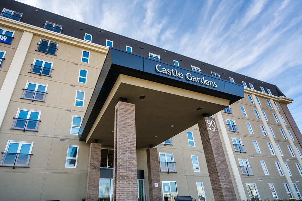 The front of a building with the words Castle Gardens on it.