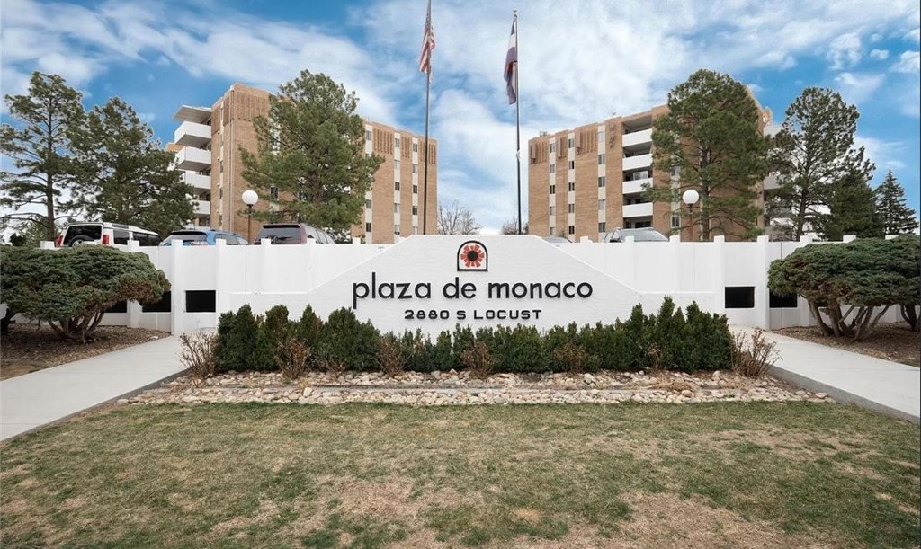 Plaza de Monaco sign in front of a building.