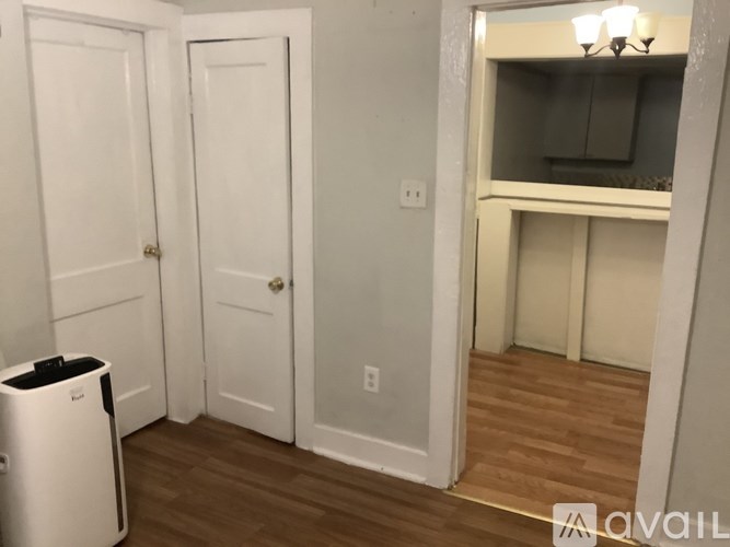 A white door is on the left and a white closet is on the right.