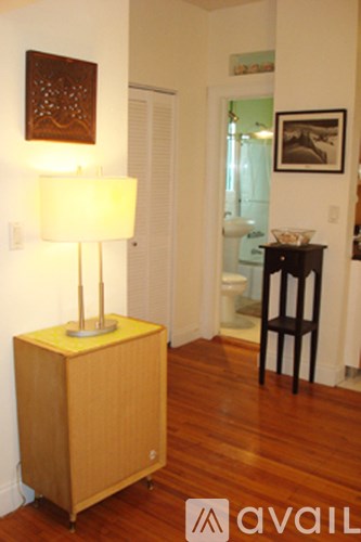 A lamp on a table in a room.