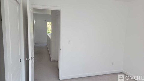 A room with a doorway leading to another room.