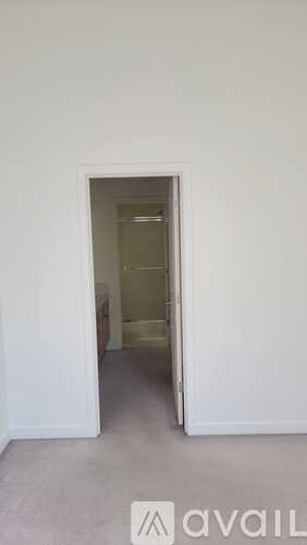 A room with a doorway leading to another room.