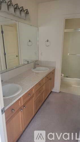 A bathroom with a sink and mirror.