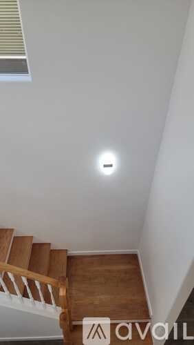 A staircase with a light on the ceiling.