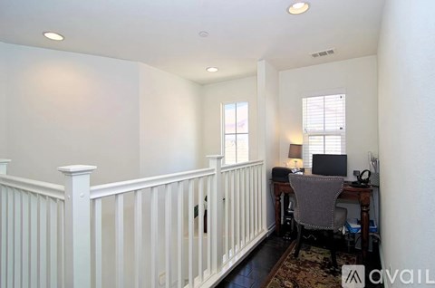 A room with a desk and a computer on it.