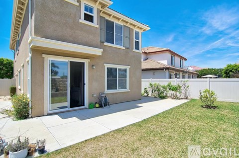 A modern house with a well-maintained lawn and garden.