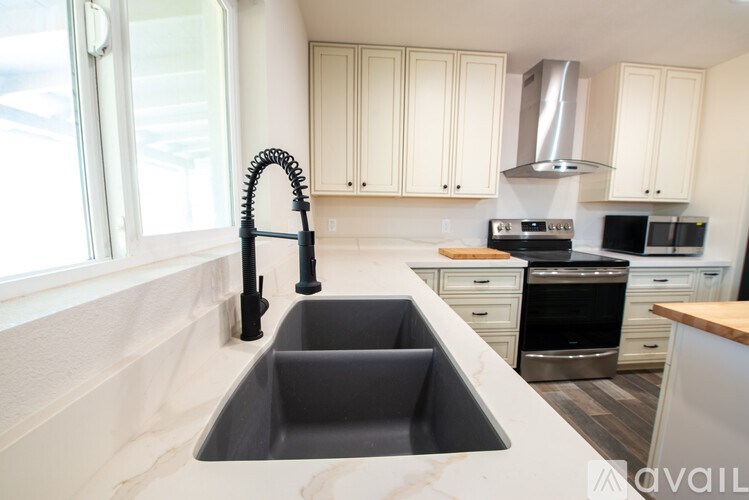 A kitchen with a sink and a window.