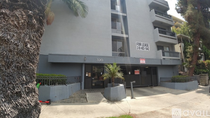 A building with a for lease sign on the front.