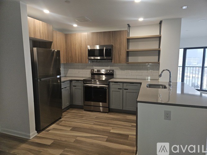 A kitchen with wooden cabinets and stainless steel appliances.