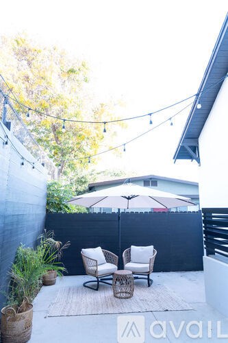A patio with chairs and a table is shown.