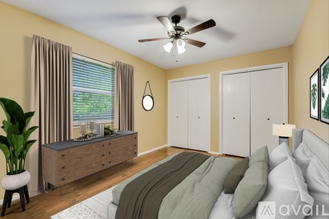 A bedroom with a bed, dresser, and window with curtains.