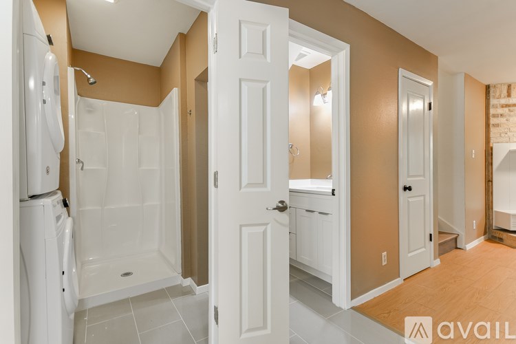 A bathroom with a walk-in shower and a toilet.