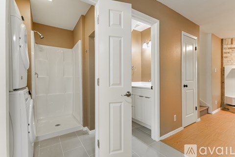 A bathroom with a walk-in shower and a toilet.