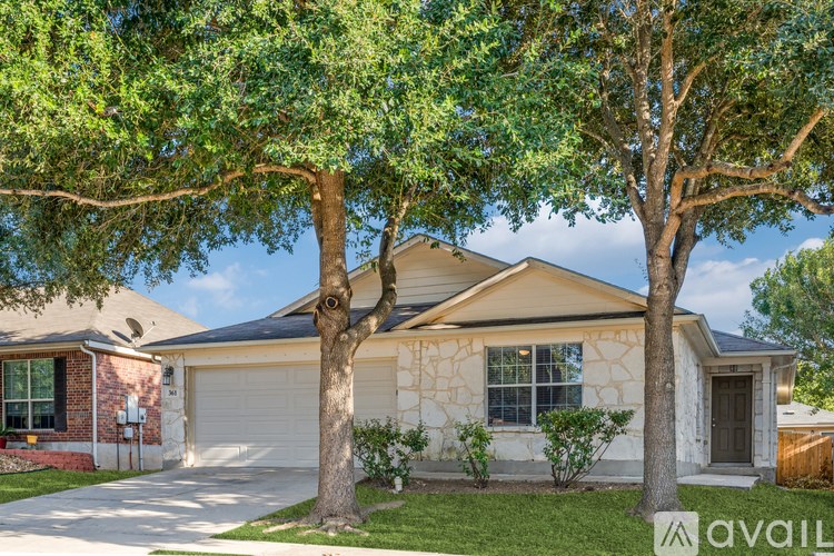 A house with a tree in front of it.