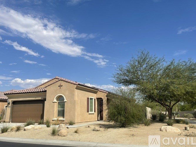 A house with a brown roof and a brown garage door is for sale.