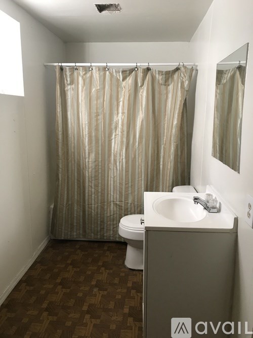 A bathroom with Avail sign on the cabinet.