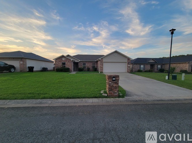 A residential area with houses and a street lamp.