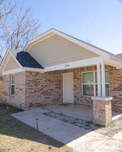 A house with the number 3008 on the front door.