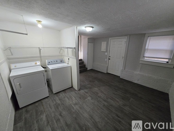 A small bedroom with a bed, dresser, and closet.