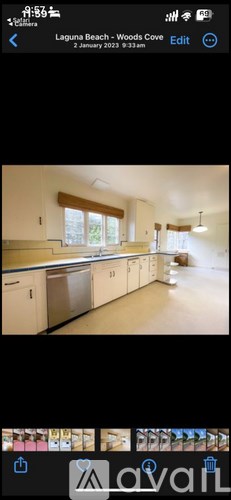 A kitchen with white cabinets and a stainless steel dishwasher.