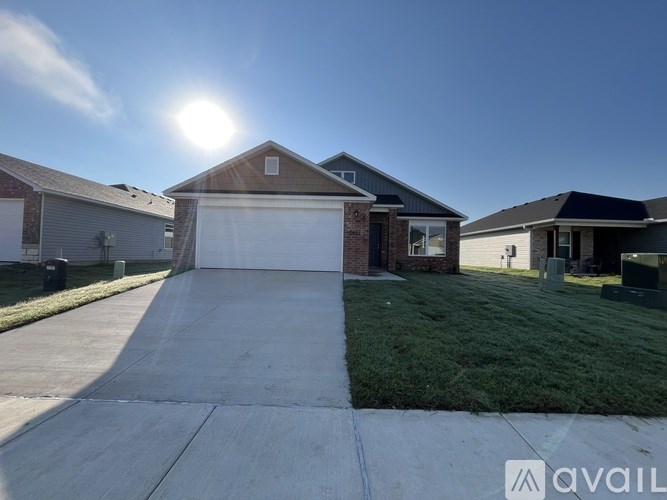 A house with a driveway in front of it is available for sale.