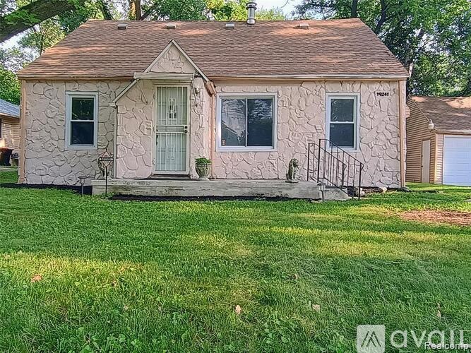A house with a green door and a small porch.